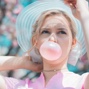 A picture of Daisy blowing her gum like a balloon.